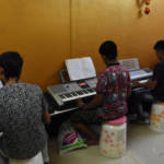 Students Practicing Keyboard Lessons
