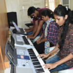 Students Practicing Keyboard Lessons
